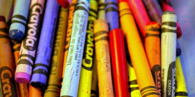 A close-up photo of of bunch of colorful crayons
